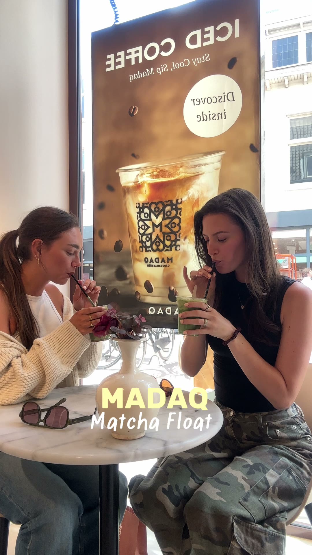 Two friends drinking a Madaq matcha float