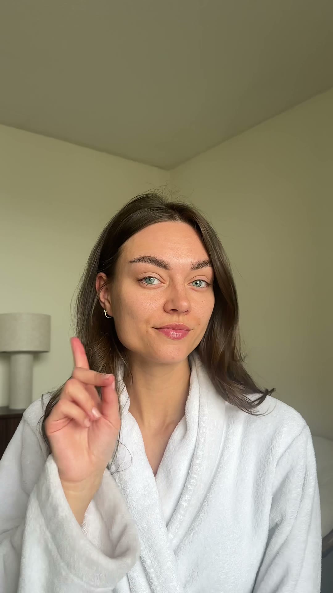 Sabine in a bathrobe during her morning routine